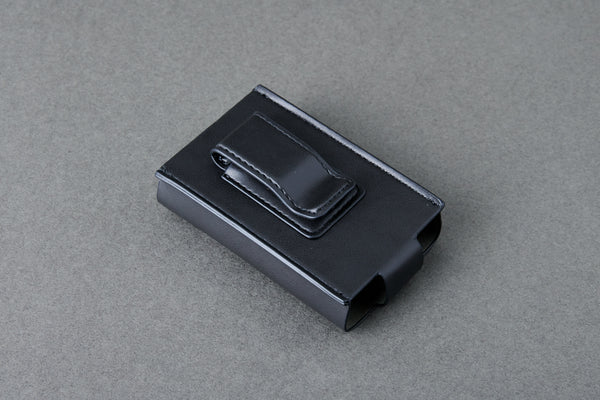 Black plastic clip on a gray background