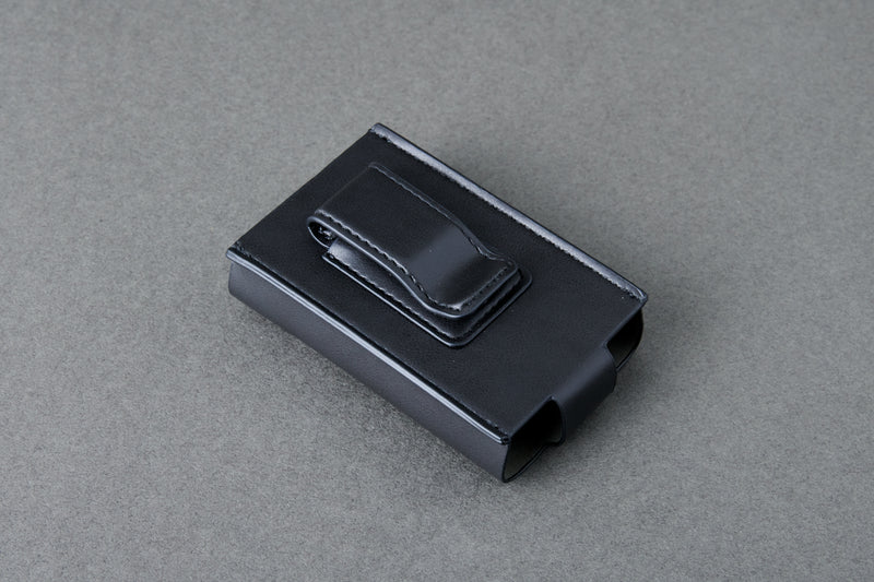 Black plastic clip on a gray background
